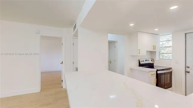 a kitchen with stainless steel appliances a refrigerator and a sink