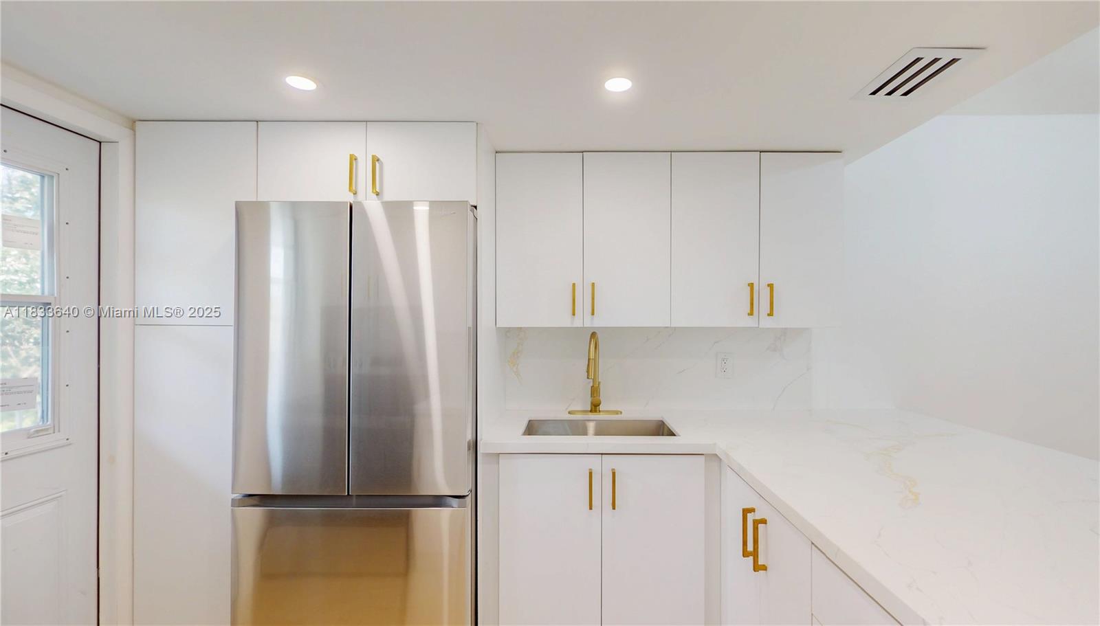1333 East Hallandale Beach Boulevard, Unit 326 Hallandale Beach, FL 33009 - Photo 15 of 38 a kitchen with stainless steel appliances a refrigerator and a sink