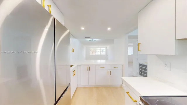 a view of kitchen with wooden floor