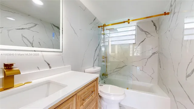a kitchen with cabinets a sink and appliances