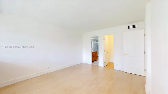 a bathroom with a sink a toilet and a window