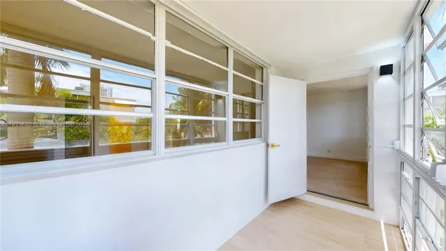 a view of a hallway with windows