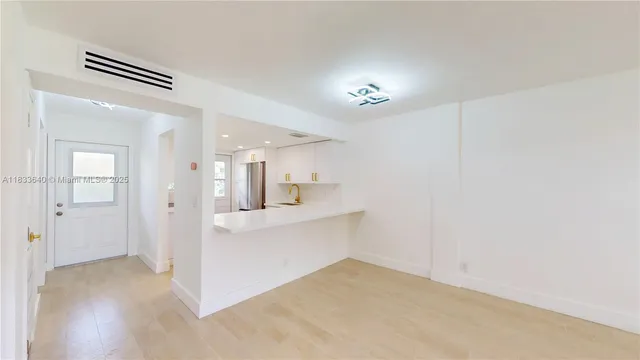 a view of kitchen and windows