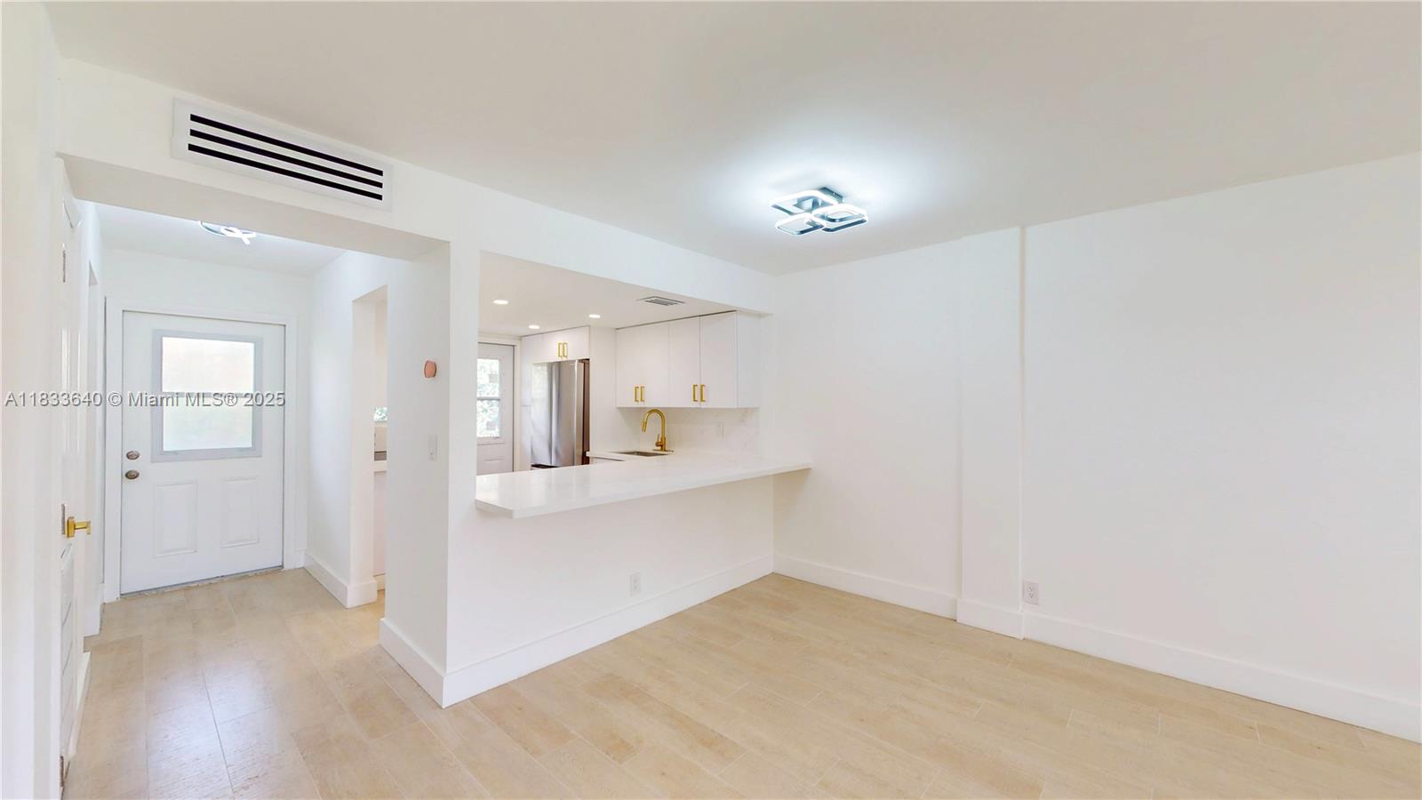 1333 East Hallandale Beach Boulevard, Unit 326 Hallandale Beach, FL 33009 - Photo 4 of 38 a view of kitchen and windows