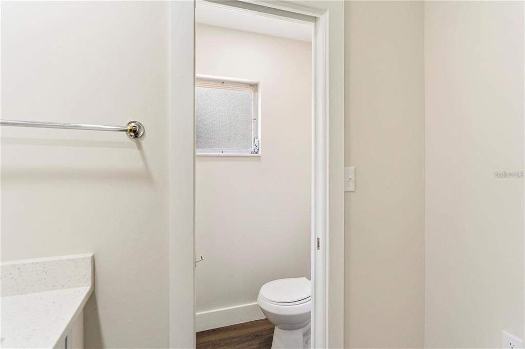 616 Water Road Ocala, FL 34472 - Photo 13 of 32 a bathroom with a granite countertop toilet and a sink