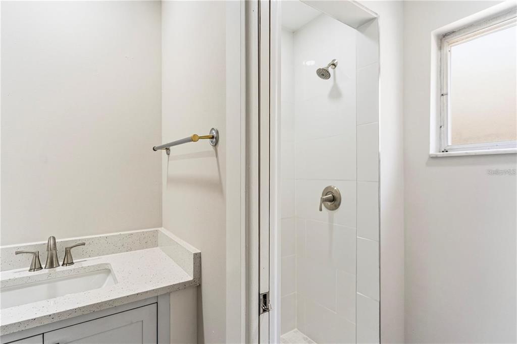616 Water Road Ocala, FL 34472 - Photo 14 of 32 a bathroom with a sink and mirror
