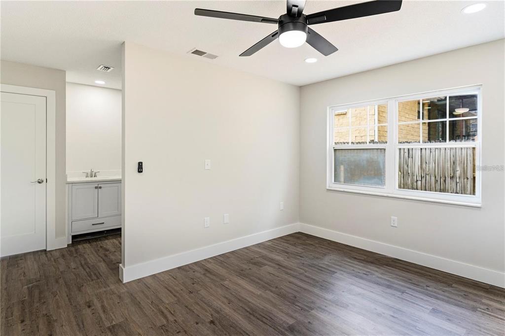 616 Water Road Ocala, FL 34472 - Photo 16 of 32 a view of empty room with wooden floor and fan