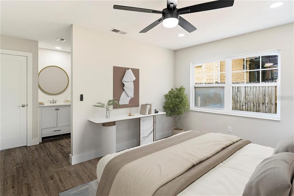 616 Water Road Ocala, FL 34472 - Photo 17 of 32 a bedroom with a large bed and a window