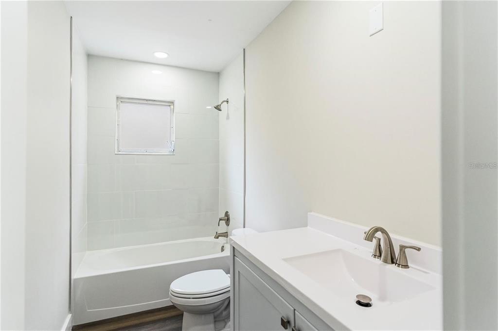 616 Water Road Ocala, FL 34472 - Photo 21 of 32 a bathroom with a sink a toilet and shower