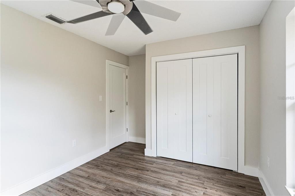 616 Water Road Ocala, FL 34472 - Photo 23 of 32 a view of an empty room with wooden floor