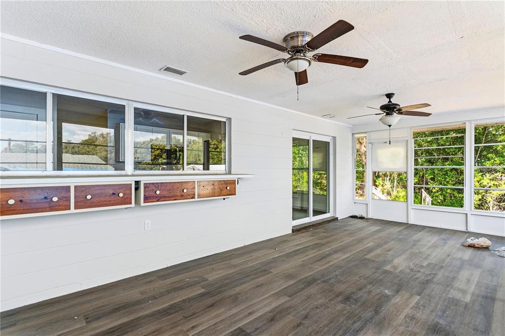 616 Water Road Ocala, FL 34472 - Photo 26 of 32 a view of an empty room with a window and wooden floor