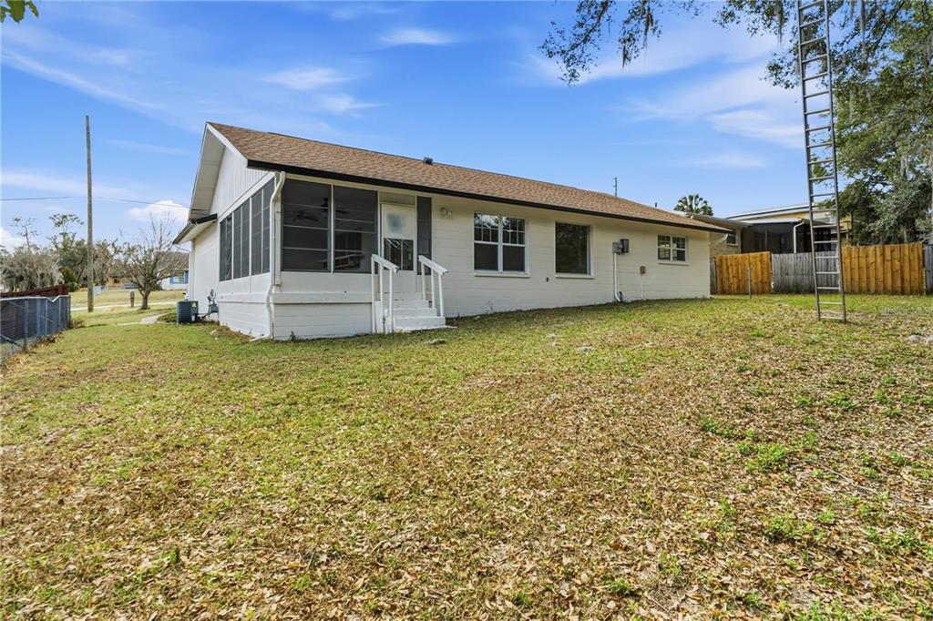 616 Water Road Ocala, FL 34472 - Photo 27 of 32 a front view of a house with garden