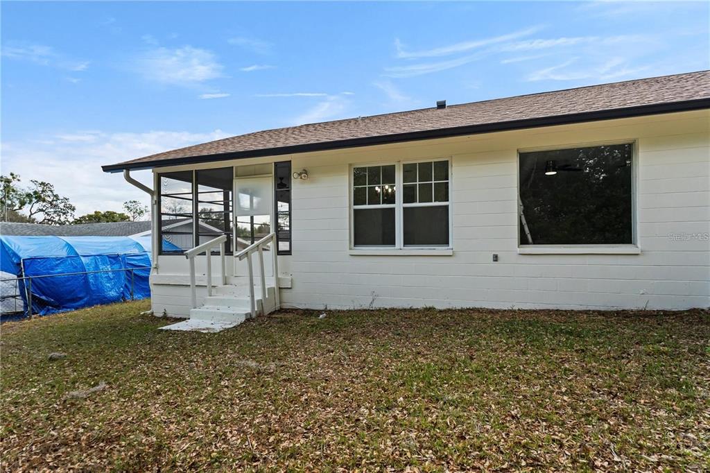 616 Water Road Ocala, FL 34472 - Photo 30 of 32 a house with trees in the background