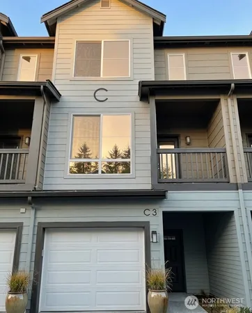 a front view of a house with a garage