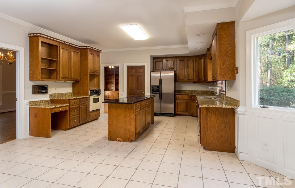 1205 Little Creek Road Durham, NC 27713 - Photo 5 of 22 Large kitchen with granite counters and suitably large island with cooktop