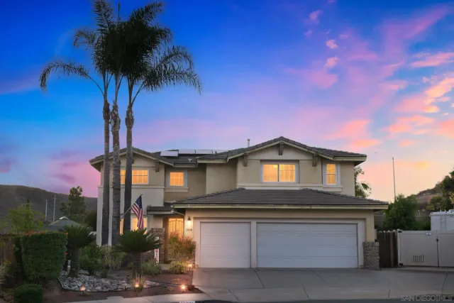 a front view of a house with yard and entryway