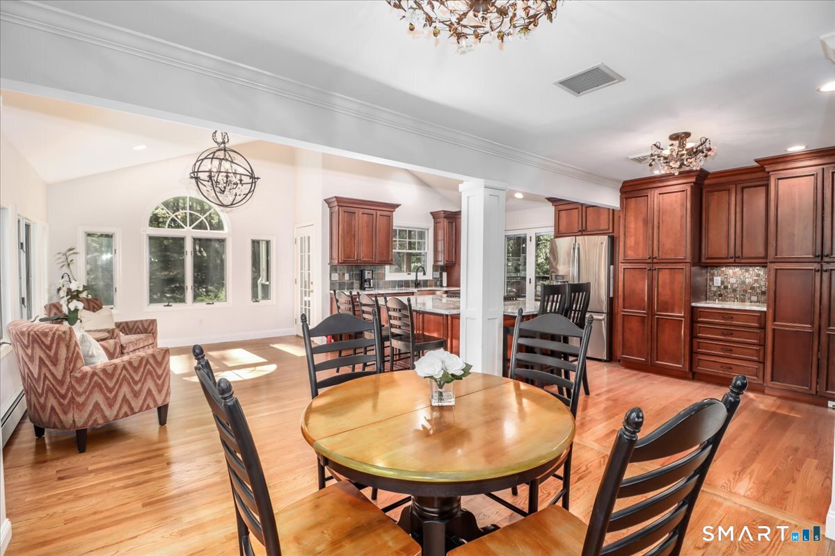 28 Fieldcrest Drive Ridgefield, CT 06877 - Photo 11 of 36 a view of a dining room with furniture window and wooden floor