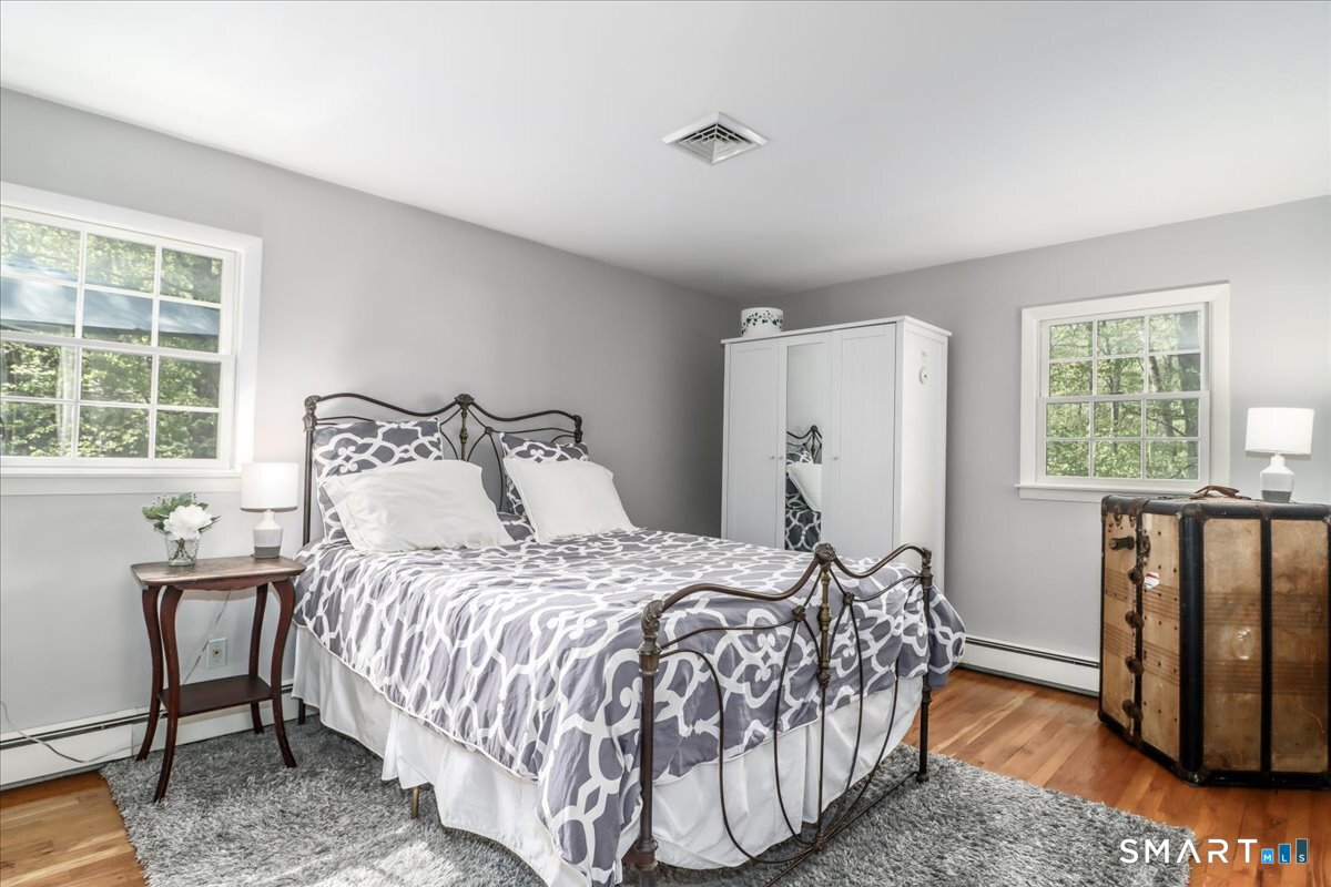 28 Fieldcrest Drive Ridgefield, CT 06877 - Photo 14 of 36 a bedroom with a bed and a window