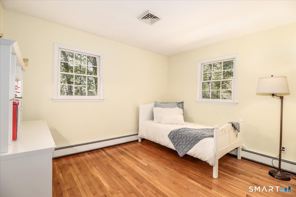 28 Fieldcrest Drive Ridgefield, CT 06877 - Photo 15 of 36 a bedroom with a bed and a window