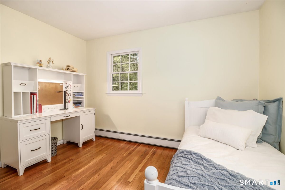 28 Fieldcrest Drive Ridgefield, CT 06877 - Photo 16 of 36 a room with a bed and a desk