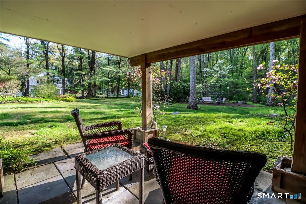 28 Fieldcrest Drive Ridgefield, CT 06877 - Photo 22 of 36 a view of a chairs in backyard of the house