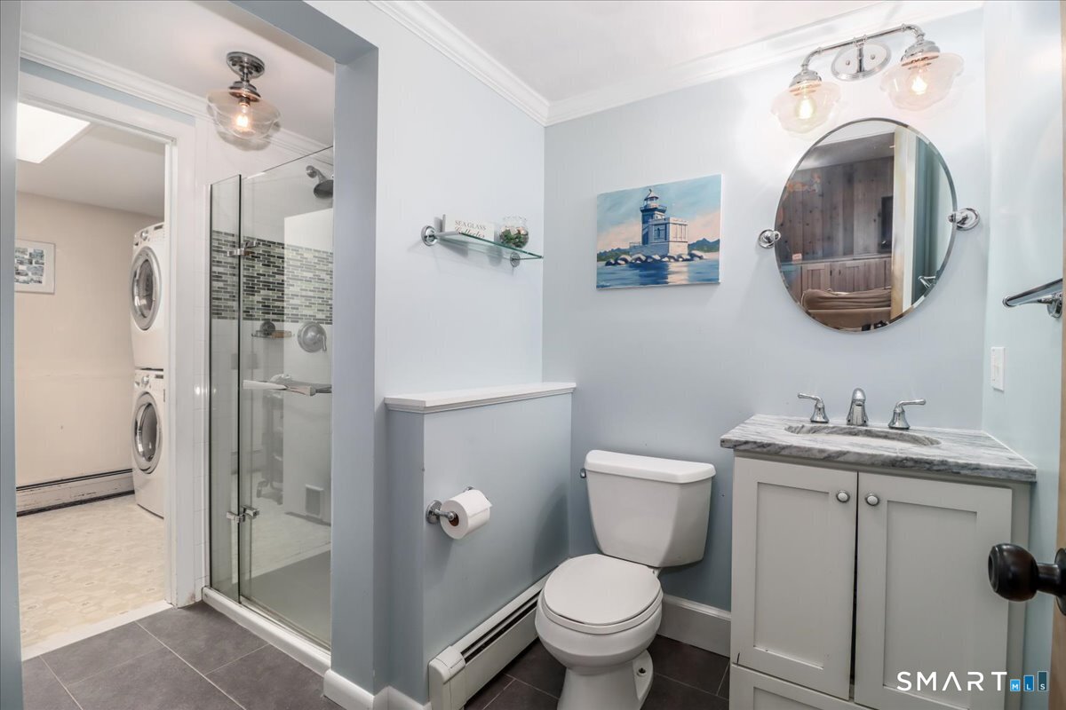 28 Fieldcrest Drive Ridgefield, CT 06877 - Photo 23 of 36 a bathroom with a toilet a sink and mirror