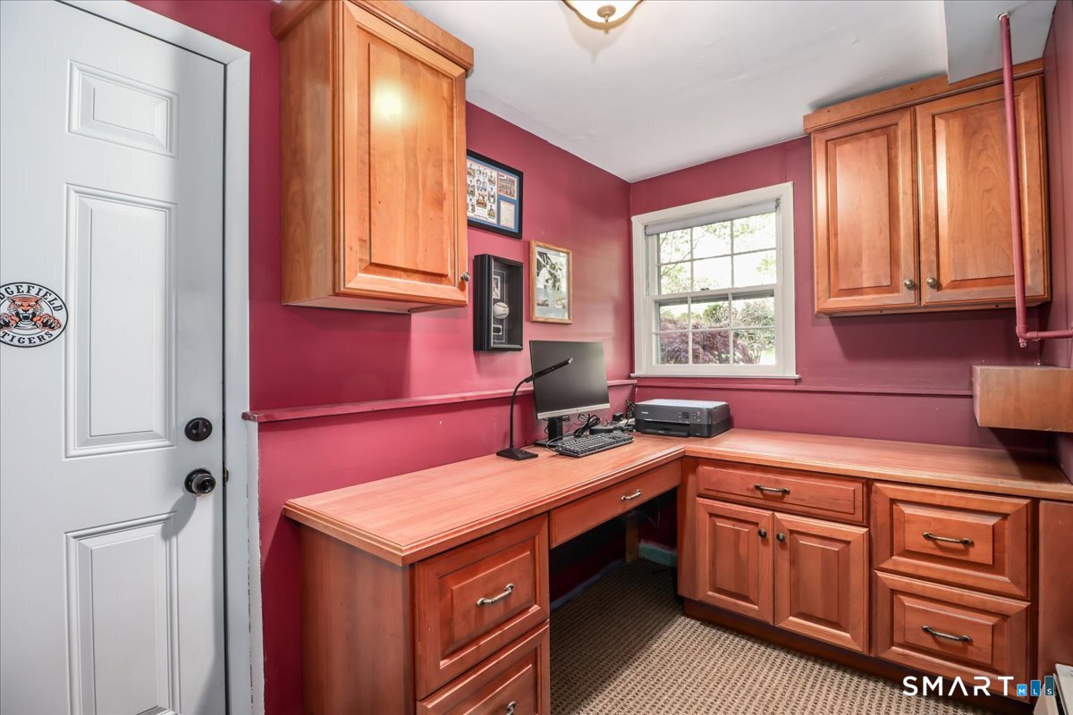28 Fieldcrest Drive Ridgefield, CT 06877 - Photo 24 of 36 a kitchen with stainless steel appliances granite countertop a sink stove and cabinets