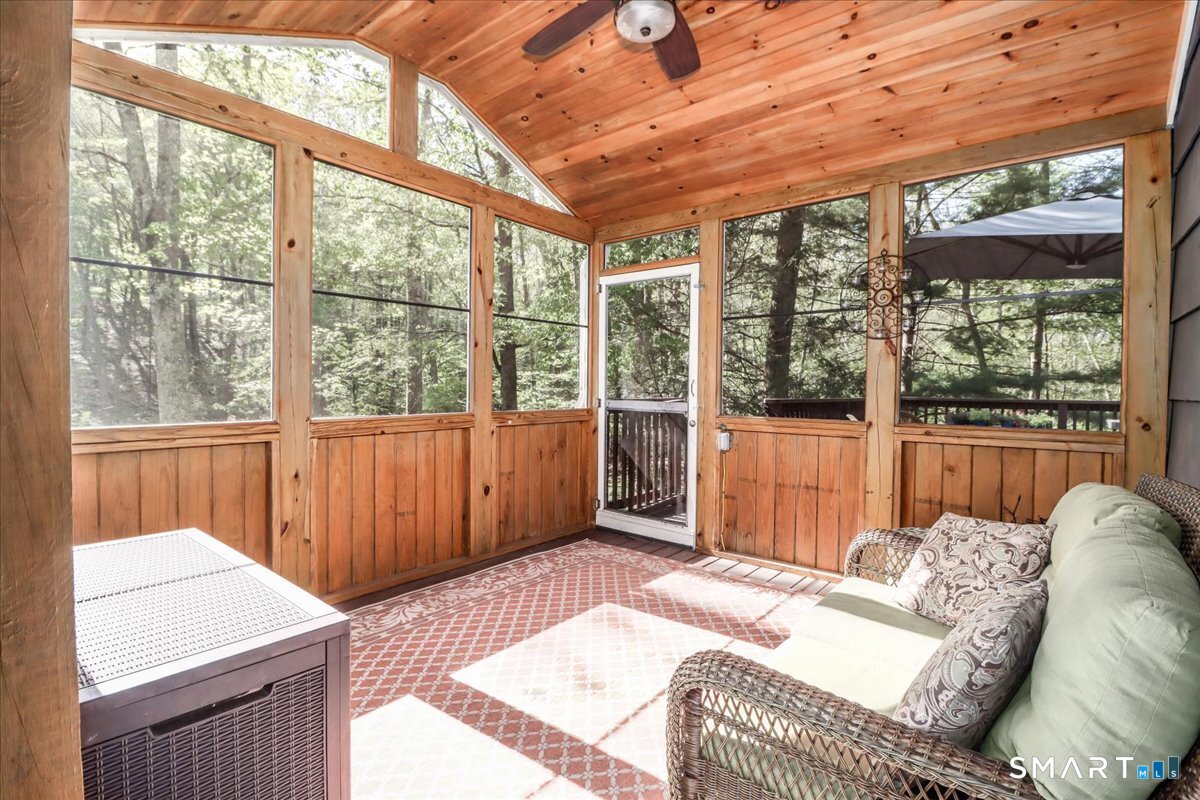 28 Fieldcrest Drive Ridgefield, CT 06877 - Photo 29 of 36 a bedroom with furniture and large windows