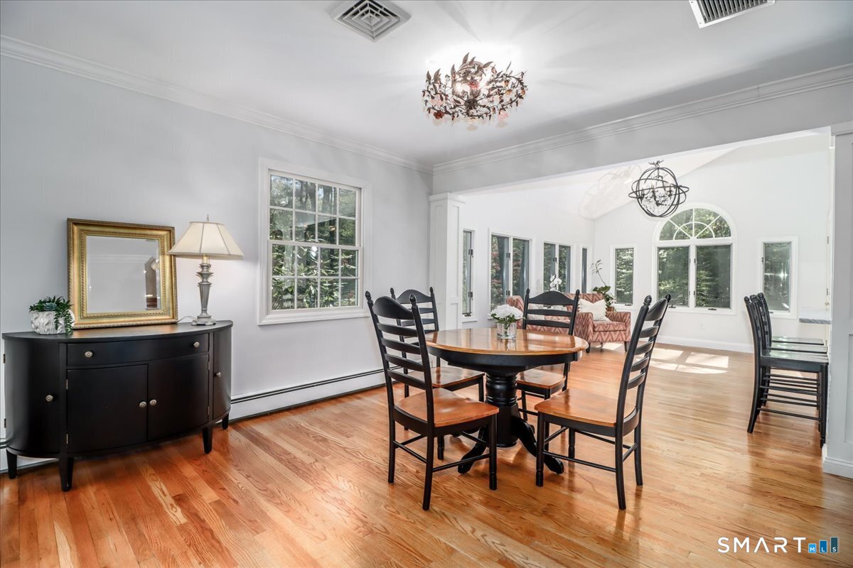 28 Fieldcrest Drive Ridgefield, CT 06877 - Photo 8 of 36 a view of a dining room with furniture window and wooden floor