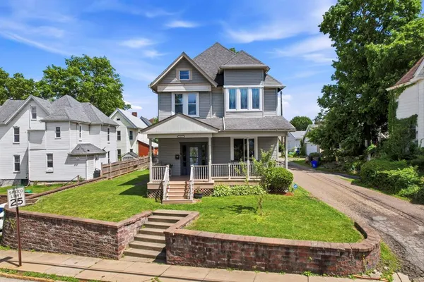 a front view of a house with a yard