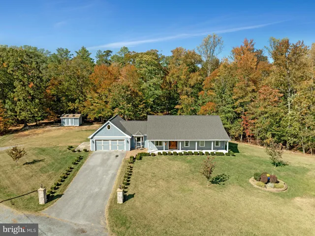swimming pool view with a tree in the background