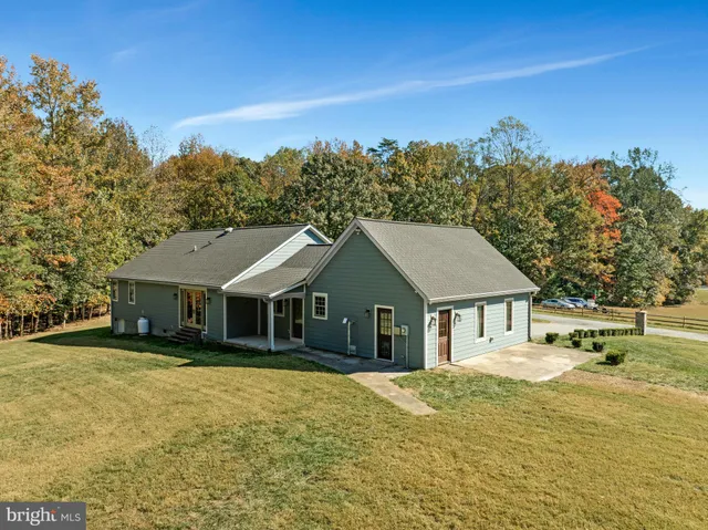 an aerial view of residential house with outdoor space