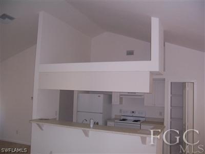 514 Raintree Street East Lehigh Acres, FL 33974 - Photo 5 of 10 a bathroom with a sink and a mirror