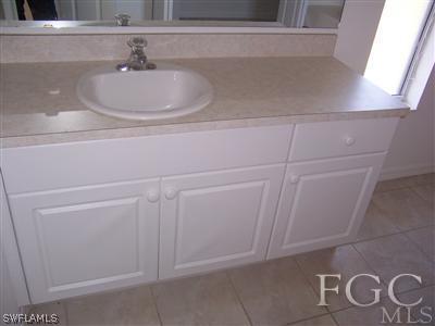 514 Raintree Street East Lehigh Acres, FL 33974 - Photo 8 of 10 a bathroom with a sink