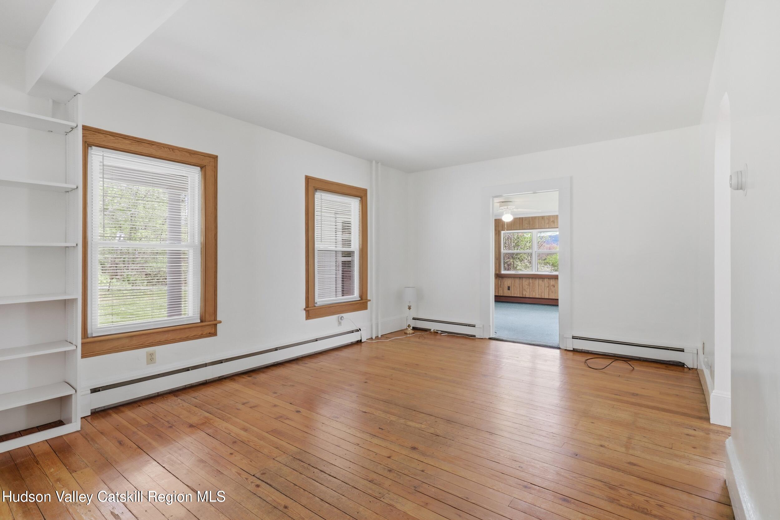294 Kyserike Road Accord, NY 12404 - Photo 9 of 46 an empty room with wooden floor and windows