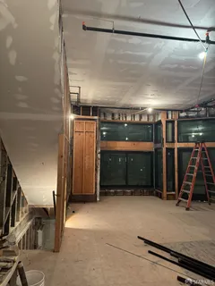 a room with gym equipment and a table