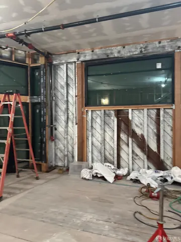 a view of an empty room with wooden walls