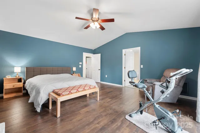 a spacious bathroom with a double vanity sink a mirror and shower