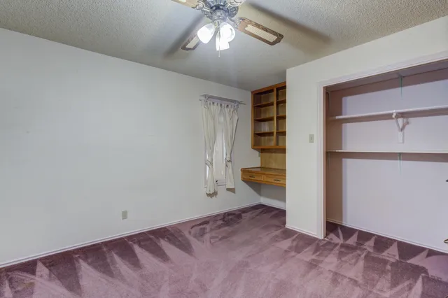 an empty room with a view of a bathroom