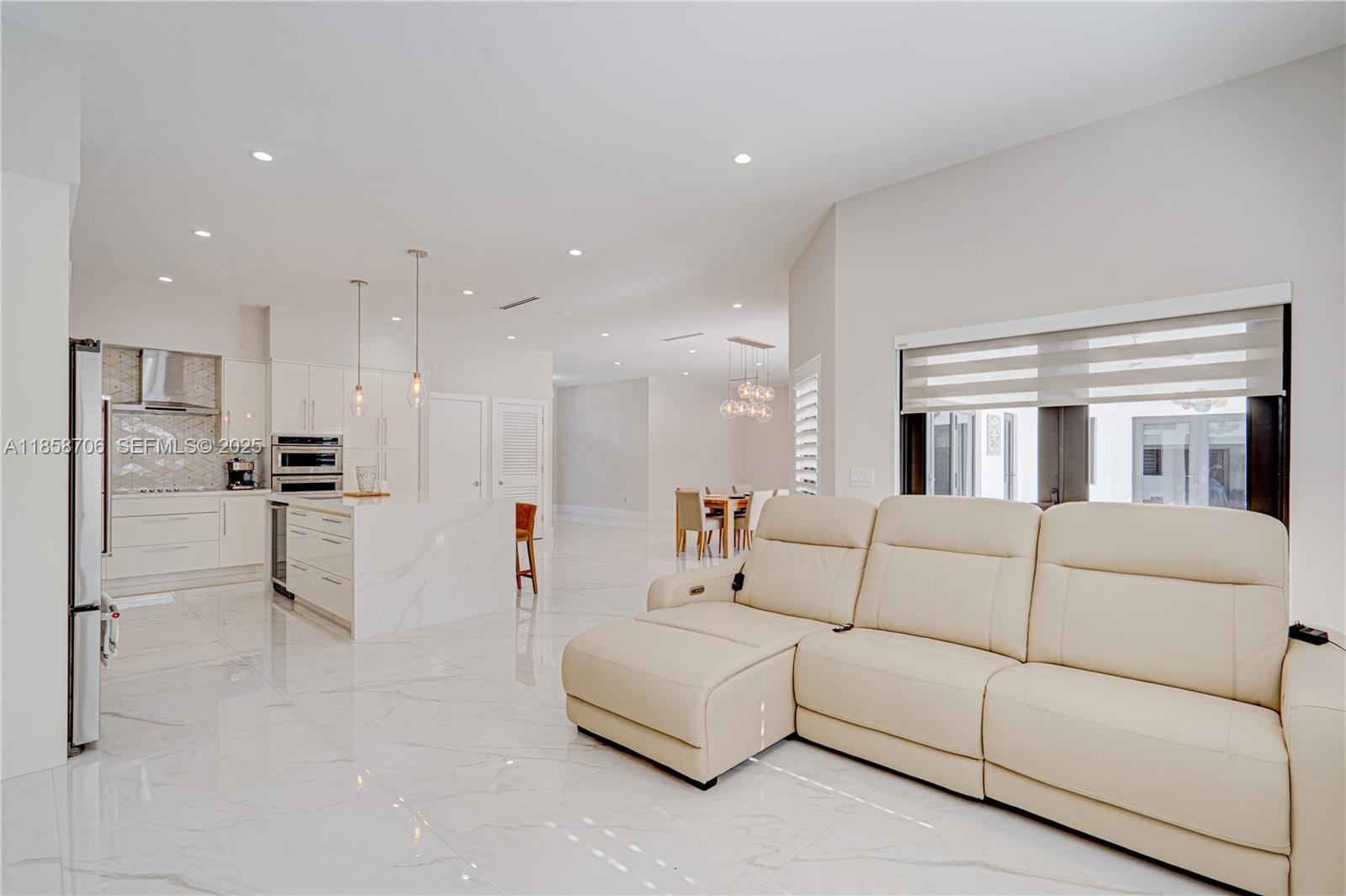 2521 Southwest 105th Avenue Miami, FL 33165 - Photo 12 of 68 a living room with furniture and kitchen view