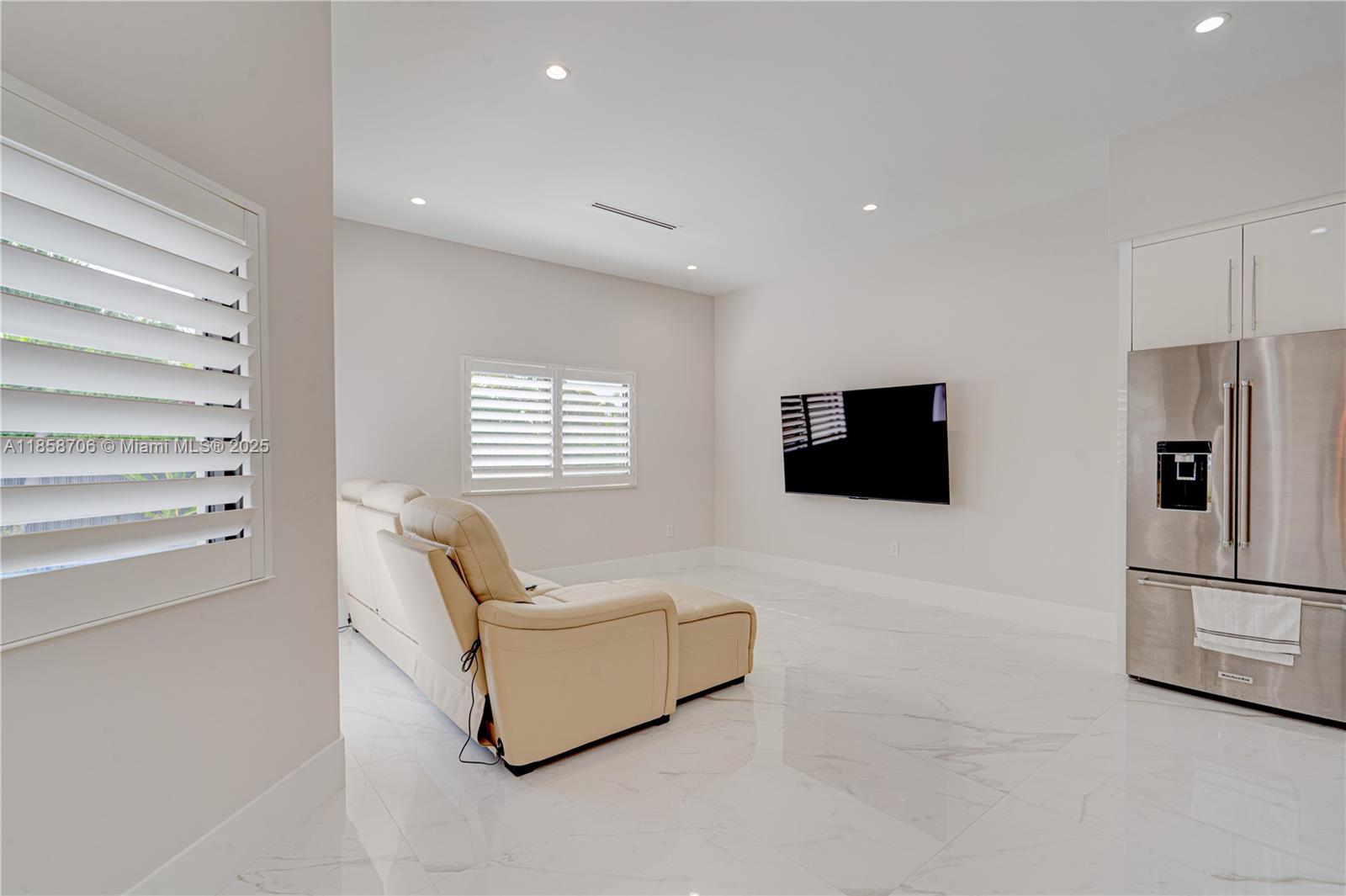 2521 Southwest 105th Avenue Miami, FL 33165 - Photo 14 of 68 a living room with furniture and a flat screen tv