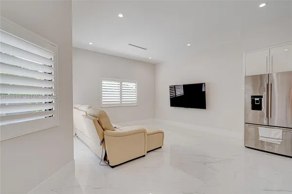 a living room with a couch and a flat screen tv