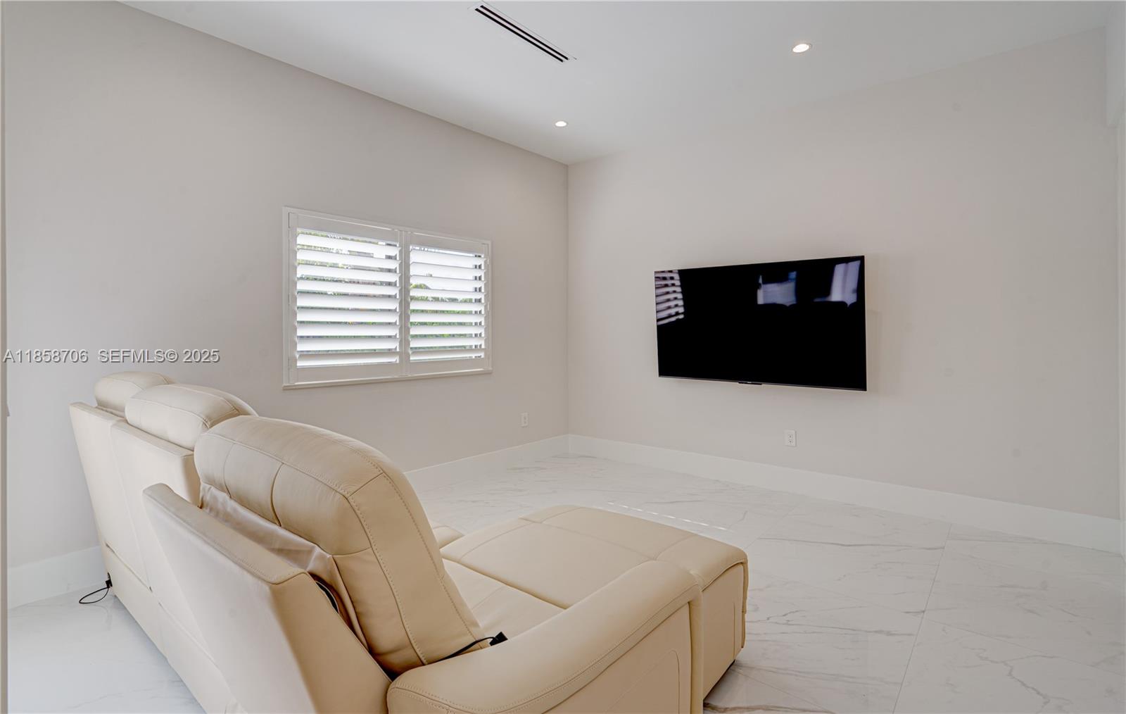 2521 Southwest 105th Avenue Miami, FL 33165 - Photo 15 of 68 a living room with a couch and a flat screen tv