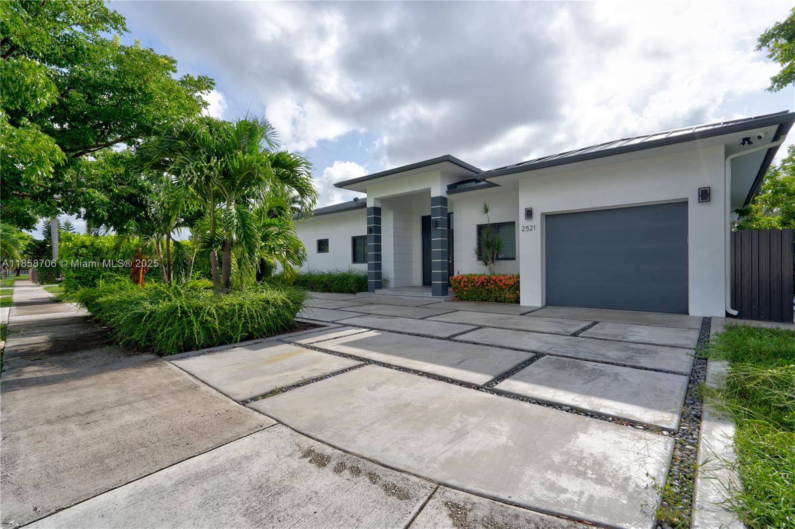 2521 Southwest 105th Avenue Miami, FL 33165 - Photo 27 of 68 a front view of a house with garden