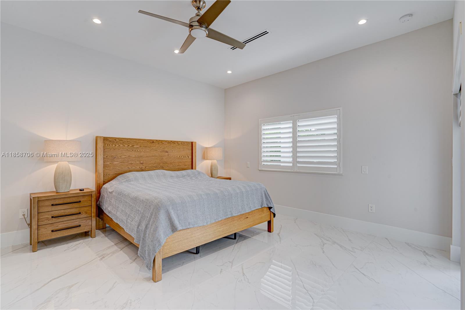 2521 Southwest 105th Avenue Miami, FL 33165 - Photo 37 of 68 a bedroom with a bed and a window