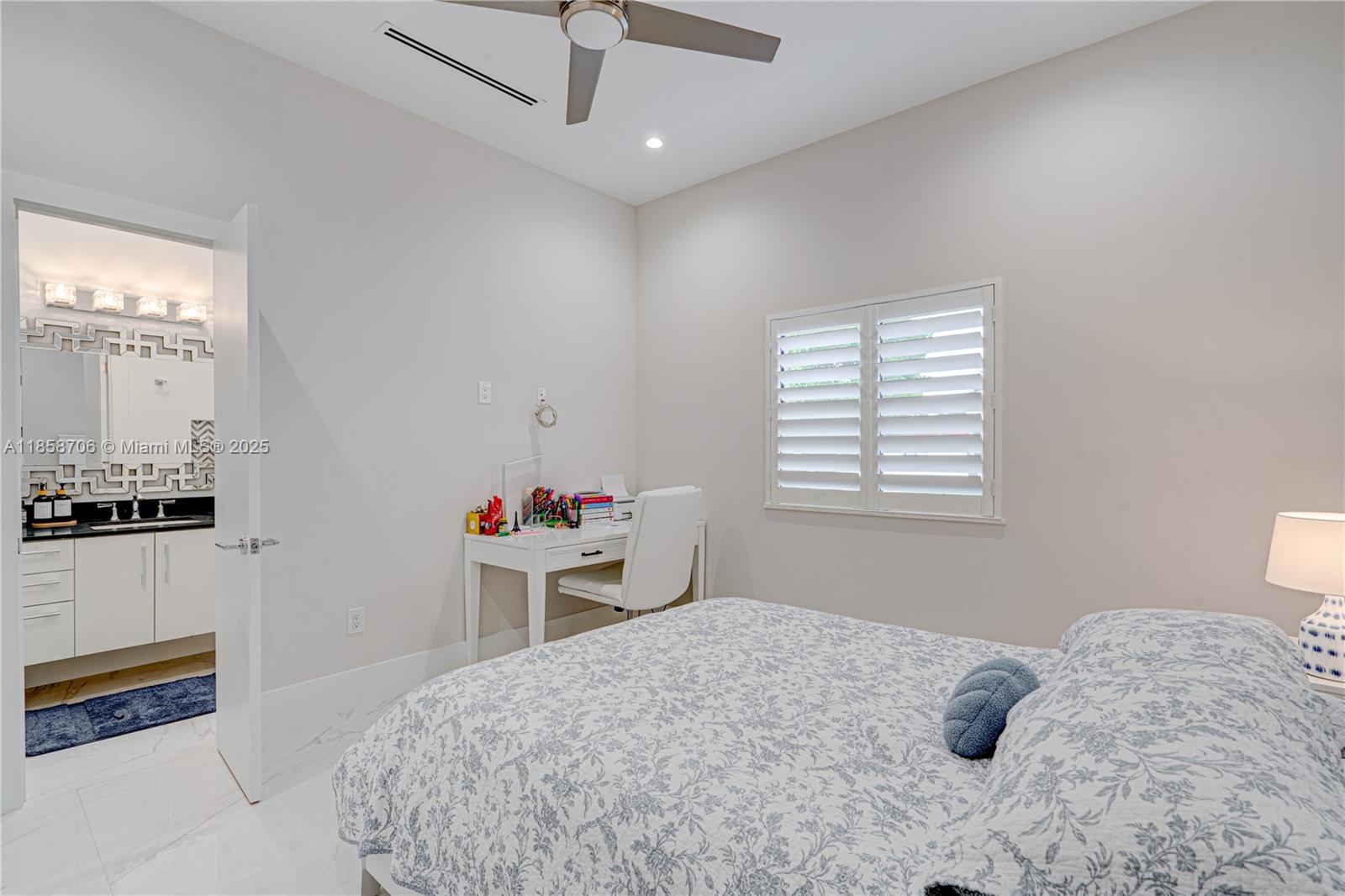 2521 Southwest 105th Avenue Miami, FL 33165 - Photo 39 of 68 a bedroom with a bed and a window
