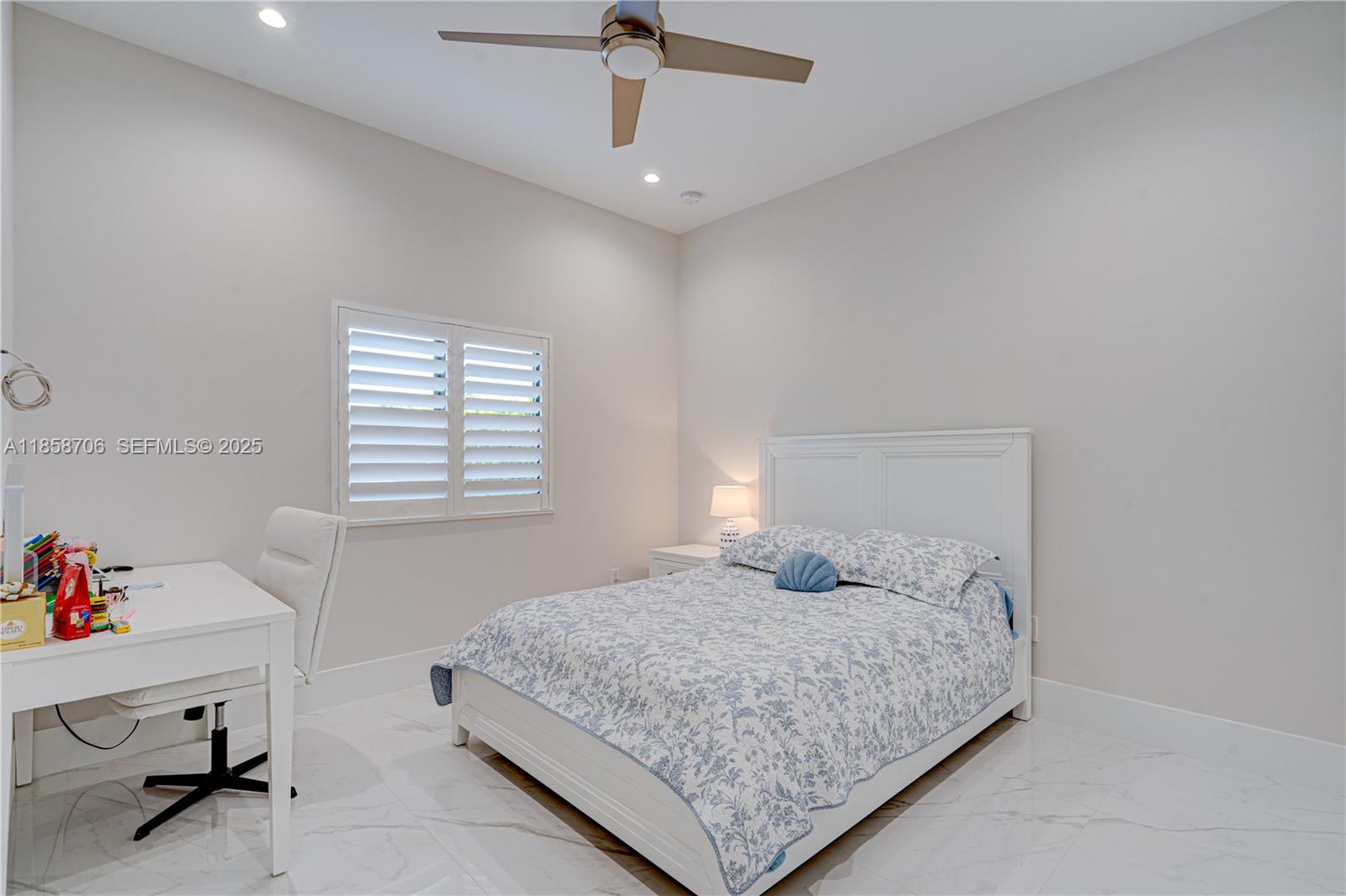 2521 Southwest 105th Avenue Miami, FL 33165 - Photo 41 of 68 a bedroom with a bed and window