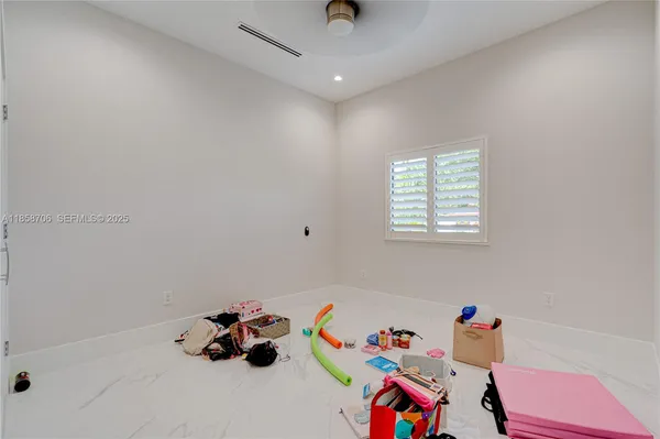 a spacious bathroom with a double vanity sink mirror and shower
