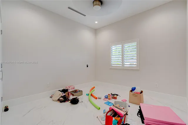 a spacious bathroom with a double vanity sink mirror and shower