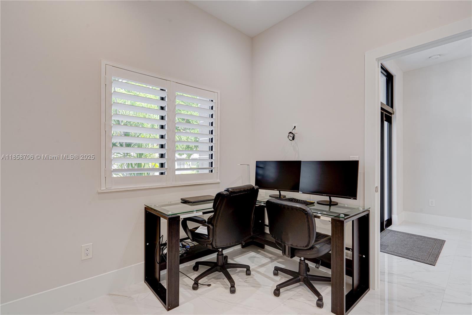 2521 Southwest 105th Avenue Miami, FL 33165 - Photo 47 of 68 a view of a workspace with furniture and a window